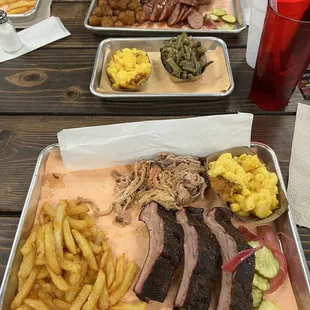 Ribs, pulled pork, mac and cheese, and fries.