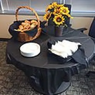 a table with a basket of pretzels and a basket of pretzels