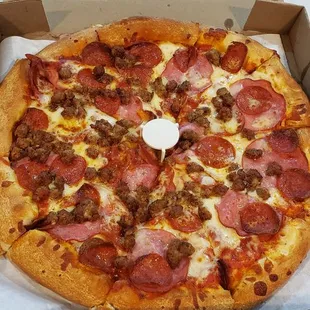 Sausage, Canadian bacon, and pepperoni pizza