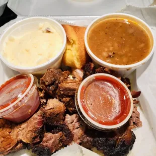 Burnt ends, cornbread, sauces, special beans, sour cream mashed potatoes