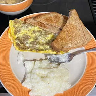 Sausage and Cheese Omelet with grits and toast