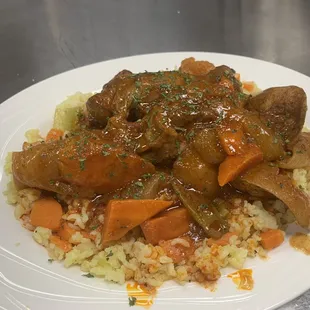 Lamb shank over rice
