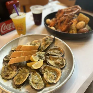 a plate of oysters and a sandwich