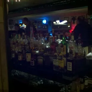 a bar filled with liquor bottles