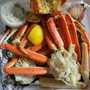 crab legs, potatoes, and carrots