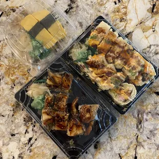 two plastic trays of food