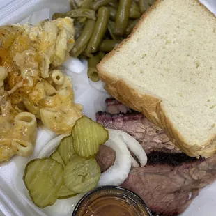 a sandwich, macaroni and cheese, and green beans