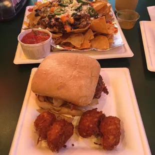 Pulled pork nachos and meatloaf sandwich with tots