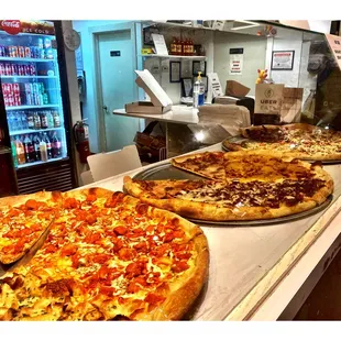 .Big G&apos;s Pizza.Still Open &amp; Rocks!Assorted Pizza Slices Ready to Go!..Take Out&amp;Delivery! My Favorite Unconventional Pizza Place!