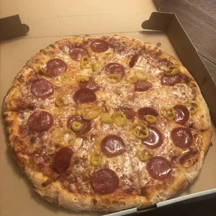 Small pizza with pepperoni and banana peppers