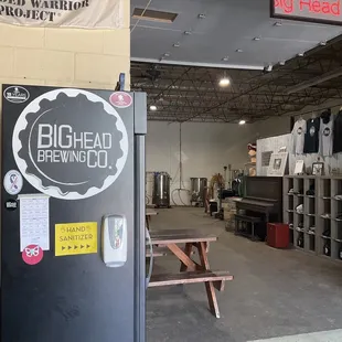 Open area and inside of brewery adjacent to bar.