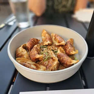 Fried pork &amp; vegetable wontons in a tasty sauce.