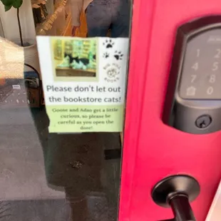 Notice: Cats in the store... please don&apos;t let out the bookstore cats!