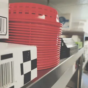red plates on a shelf