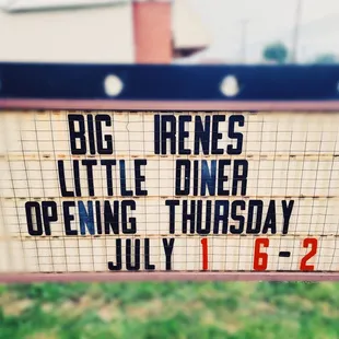 a sign for the opening