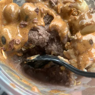 a bowl of food with a spoon in it