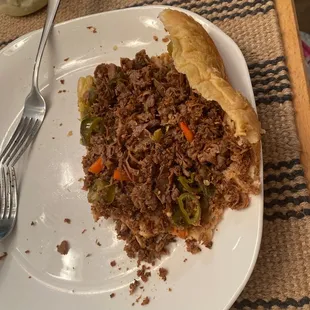 Diced meat from my beef sandwich. So thin and small it just falls out everywhere.