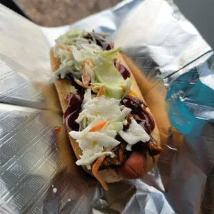 a hot dog with coleslaw