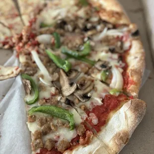 Half Cheese and half Italian sausage, mushrooms, onions and bell peppers! So good