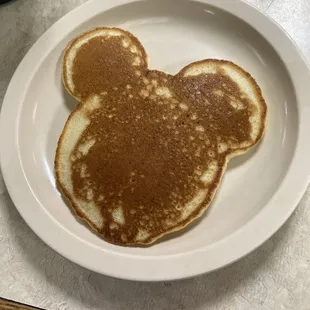 a pancake shaped like a mickey mouse head