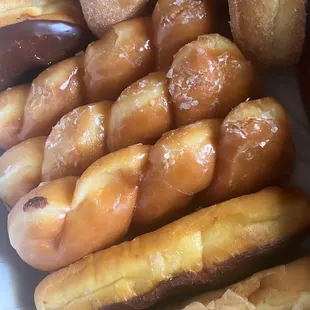 Maple bar, chocolate bar, glaze twist, chocolate donut and sugar donut.
