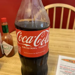 They do have coke and give them to you in these types of bottles instead of cups.