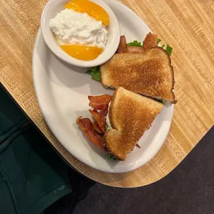 BLT with avocado and cottage cheese with peaches.