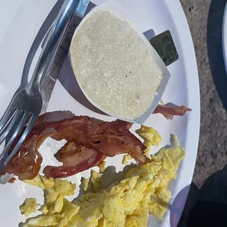 2 Eggs, Bacon or Sausage, Potatoes or Grits, Toast or Biscuit