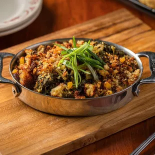 a pan of food on a cutting board