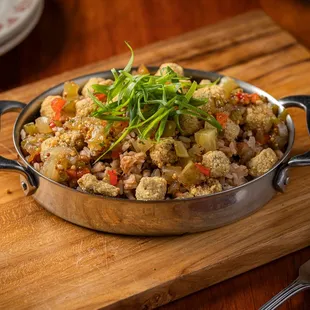 a pan of food on a cutting board