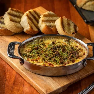 a pan of food on a cutting board