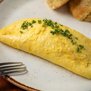 an omelet on a plate with a fork