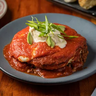 a plate of lasagna on a table