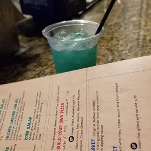 a menu and a drink