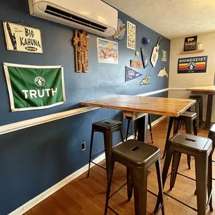 a bar with stools and a table