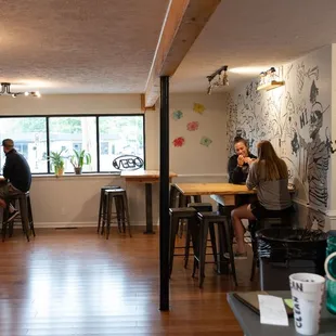 two women sitting at a table in a coffee shop