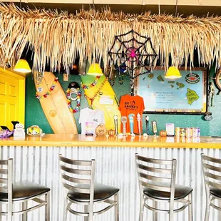 a tiki bar with surfboards