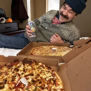 A nice man eating pizza
