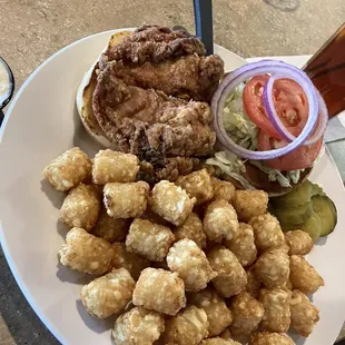 Crispy Fried Chicken Sandwich with tater tots.