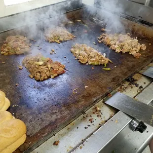 Fresh cheesesteaks on the grill