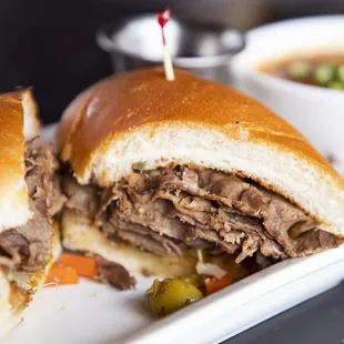 Italian Beef -  Slow cooked roast beef, giardiniera, au jus with choice of dipped or dry, hoagie bun.