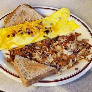 Western Omelette hash browns w/onions and wheat toast. Yummy