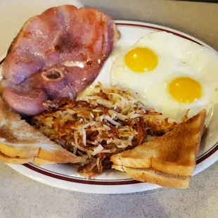 Country Ham 2 Eggs Sunnyside Up hash browns and white toast. Yummy