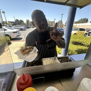 Owner prepping Hot Dog