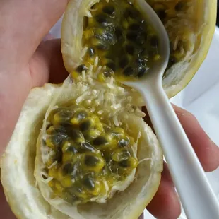 Cut it open with car keys (while still in the ignition) and a plastic spoon.  I think this is called liliquoi