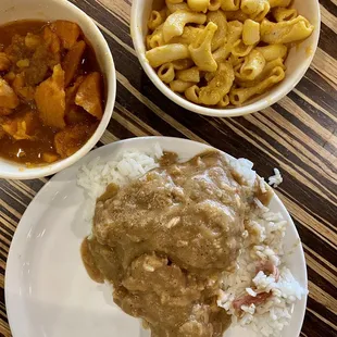 Smothered chicken &amp; rice with deliciously- sweet candied yams and cheesy mac.