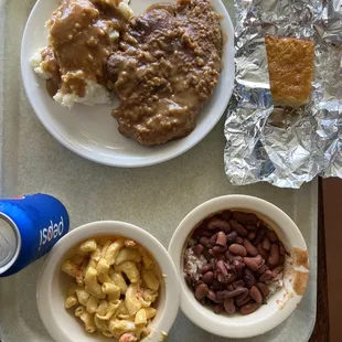 Smothered pork chops, crawfish macaroni, rice and red beans, cornbread.