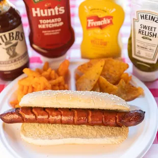 a hot dog on a bun with ketchup