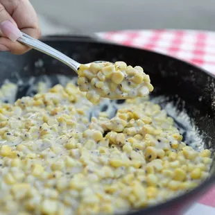 corn being cooked in a skillet