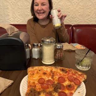 Slice of pizza and drinks from the bar